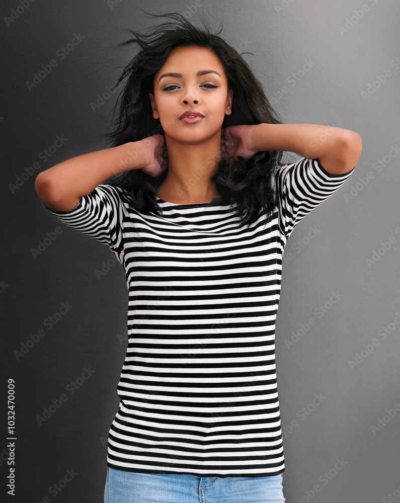 Girl, fashion and confidence in portrait with hair, volume and texture on gray background. Female person, happiness and trendy outfit for pride, clothes and style with cool, aesthetic and positivity Girl, fashion and confidence in portrait with hair, volume and texture on gray background. Female person, happiness and trendy outfit for pride, clothes and style with cool, aesthetic and positivity