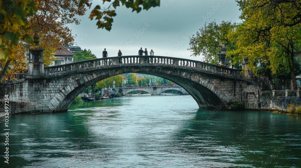 Fototapeta premium Bridge spanning a river, with pedestrians enjoying the view