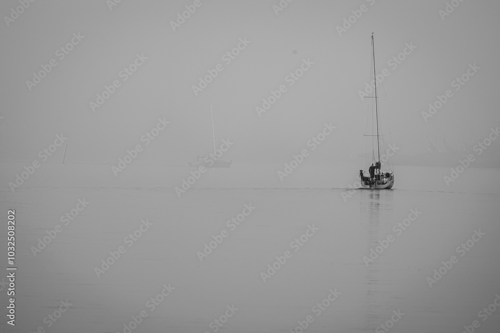 boat on the water during foggy morning boat on the water during foggy morning