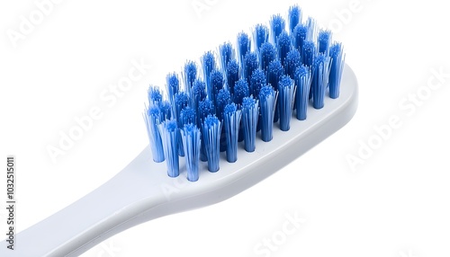 A classic white toothbrush with blue bristles, isolated on a white background, showcasing its simple, everyday design photo