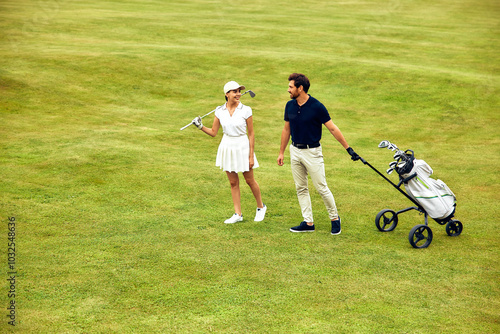 A Couple Brightening Their Day with a Fun and Enjoyable Round of Golf on the Green Grass