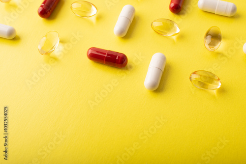 Pills. Supplements omega 3, vtamin C. White pills, red capsules on yellow background. An allergy pill, antibiotics. Medicine, healthcare concept. Virus(viral) and flu diseases. High quality photo photo