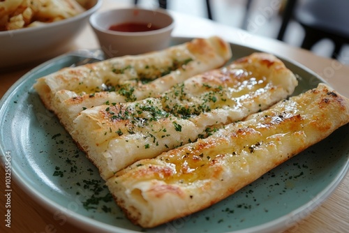 Garlic Knots with Parsley and Olive Oil on a Green Plate