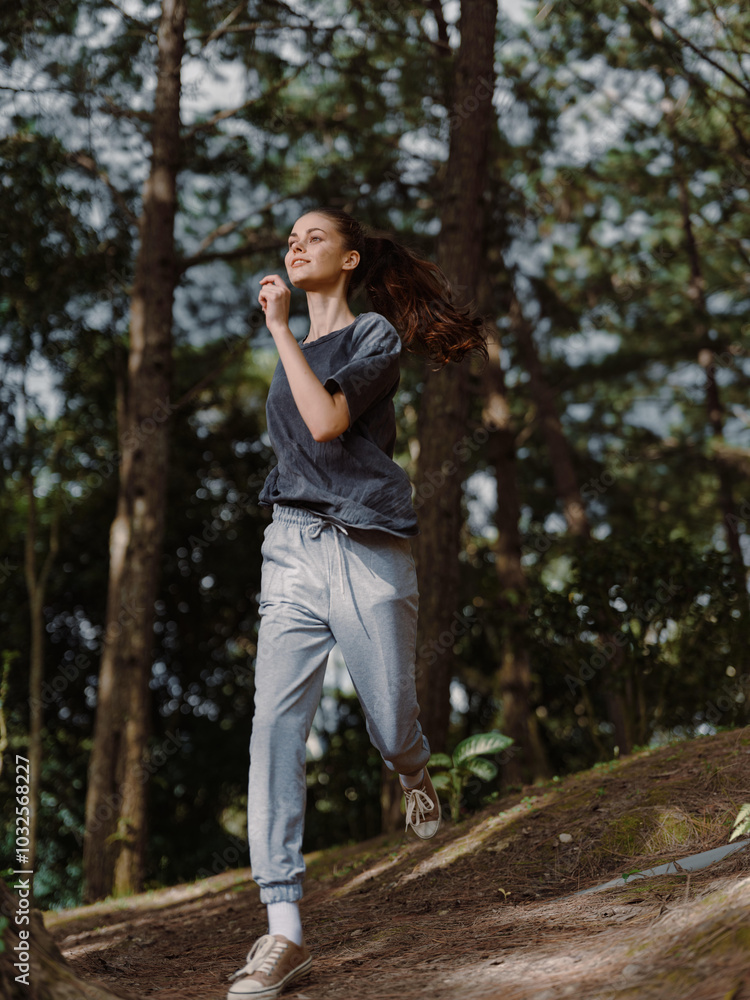 Young woman jogging through a lush forest, wearing comfortable athletic clothes and enjoying the fresh air Health and fitness concept in nature setting Young woman jogging through a lush forest, wearing comfortable athletic clothes and enjoying the fresh air Health and fitness concept in nature setting