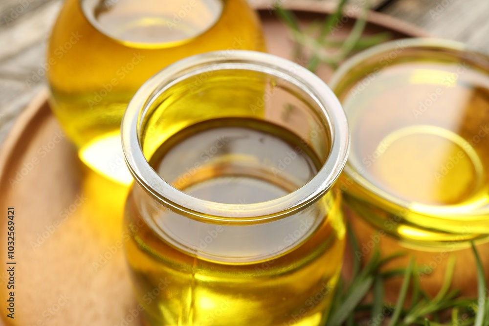 Cooking oil in jar on table, closeup Cooking oil in jar on table, closeup