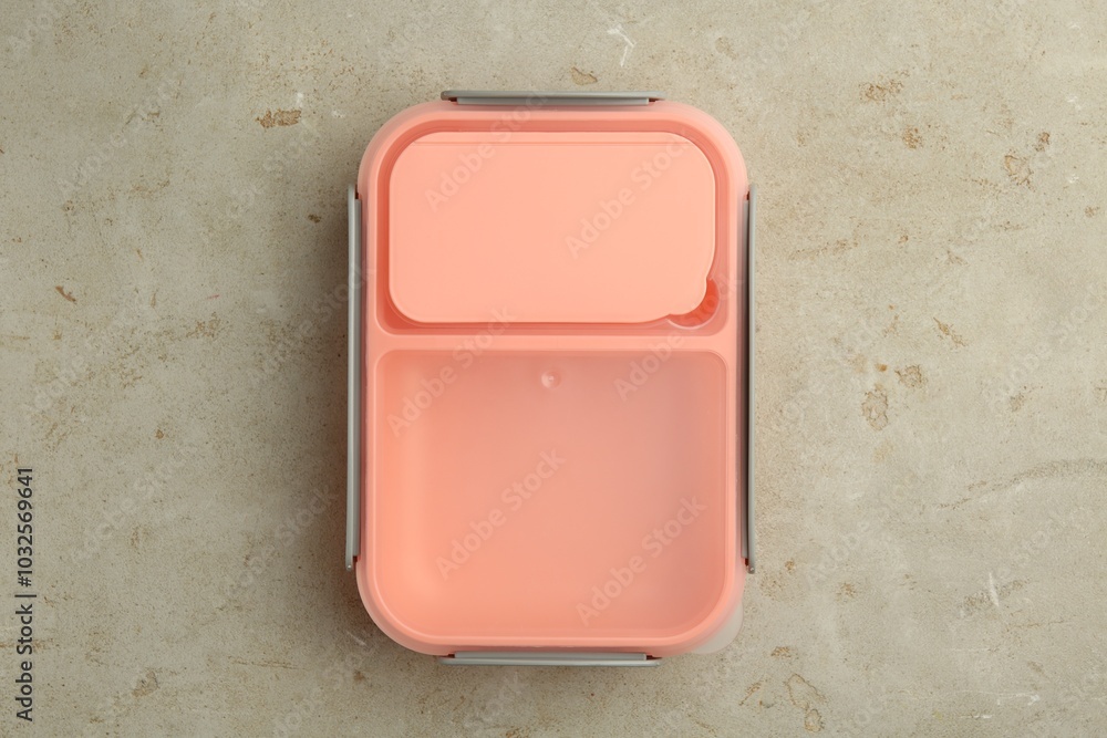 One plastic lunch box on grey table, top view One plastic lunch box on grey table, top view