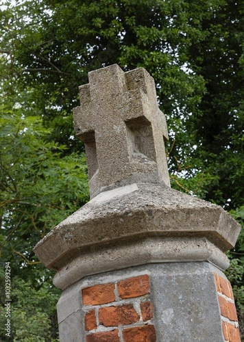 Cross at the entrance of a church in Wustrow. East Germany. Mecklenburg Vorpommern. photo