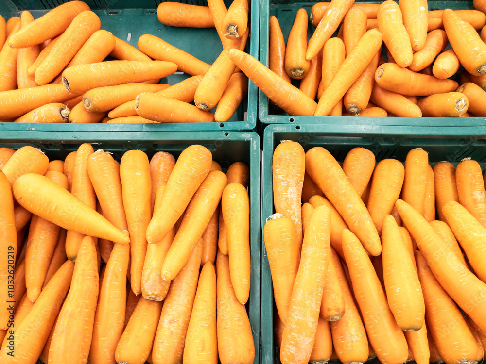 Closeup of the organic carrot in the plastic crate.