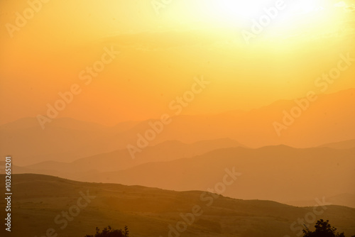 Beautiful sunset over the mountains in the summer.