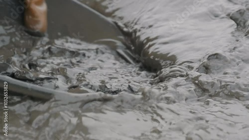 Panning To Extract Gold Dust From Mineral Rocks Using Water. Extracting Gold Dust With Water In Pan Mining Equipment. Washing Gold Dust From Stones In Water. Traditional Mining. Geology photo