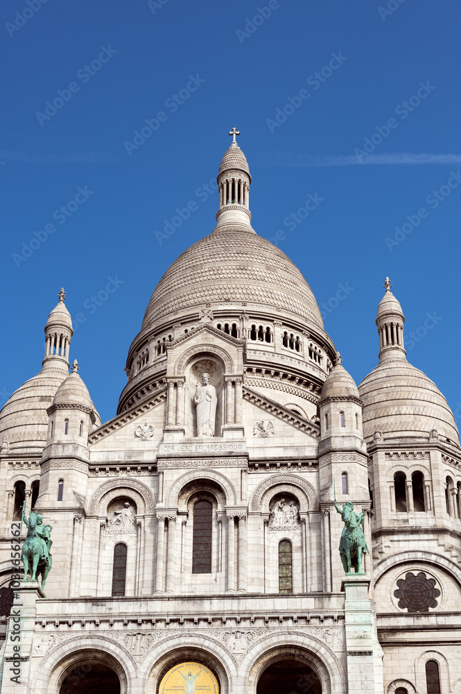 Paris, France - September 25, 2024: The Basilica of Sacre Coeur de Montmartre, commonly known as Sacre-Coeur Basilica, is a Catholic church, minor basilica in Paris dedicated to Sacred Heart of Jesus Paris, France - September 25, 2024: The Basilica of Sacre Coeur de Montmartre, commonly known as Sacre-Coeur Basilica, is a Catholic church, minor basilica in Paris dedicated to Sacred Heart of Jesus