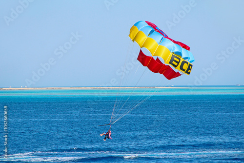 Man is fond of parasailing over Red Sea. resort in Egypt, Beautiful holidays photo