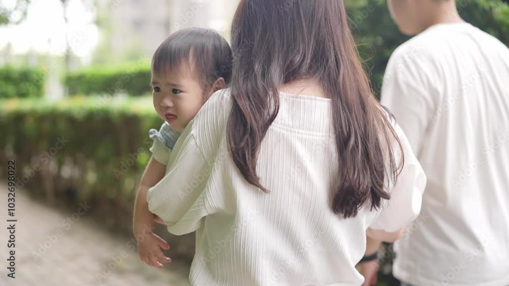 A Taiwanese family, consisting of a father in his 30s, a mother in her 20s, and their 1-year-old daughter, are walking apartment in Taichung City, Taiwan.Realtime, Horizontal Video. A Taiwanese family, consisting of a father in his 30s, a mother in her 20s, and their 1-year-old daughter, are walking apartment in Taichung City, Taiwan.Realtime, Horizontal Video.