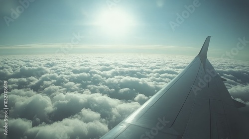 Aerial view of a plane wing above fluffy clouds at sunset during a scenic flight