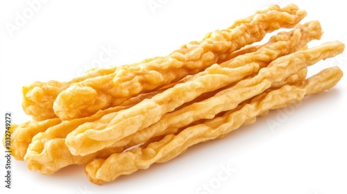 A stack of crispy, golden-brown fried dough sticks, often enjoyed as a snack.