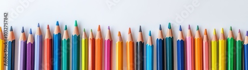 Vibrant array of colored pencils on a white background