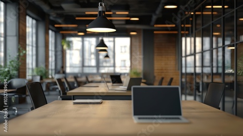 a startup office space with laptops and collaborative work areas, showcasing the creative and intellectual capital driving modern entrepreneurship