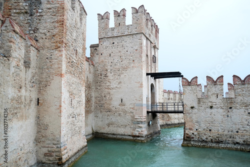 View of the castle in Sirmone (Castello Scaligero di Sirmione) one of the most spectacular and preserved fortresses on Lake Garda, province of Brescia, Italy. photo