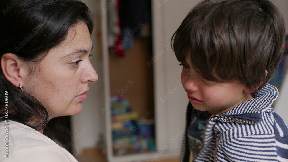 Mother and son having a serious conversation. boy is visibly upset while the mother listens attentively, moment of emotional connection and communication in a home setting Mother and son having a serious conversation. boy is visibly upset while the mother listens attentively, moment of emotional connection and communication in a home setting