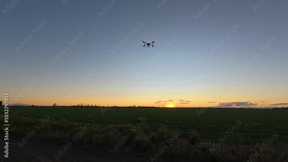 Landing of a large agricultural drone. Sunset Landing of a large agricultural drone. Sunset