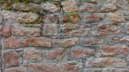 Textured Stone Wall With Various Shades Found in an Old Building Exterior