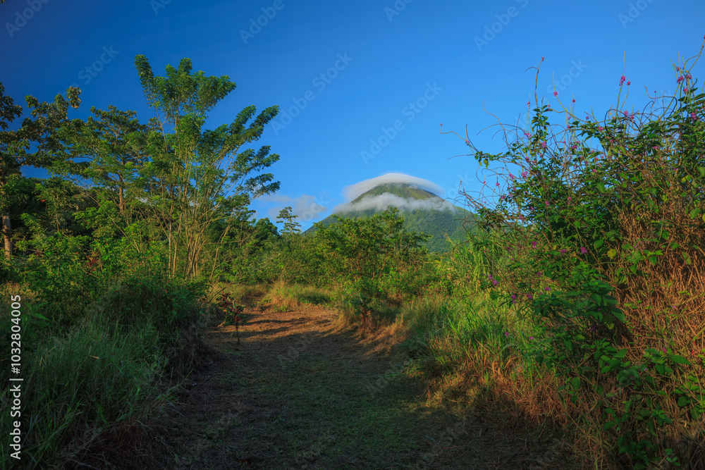 Fototapeta premium Scenic view of Arenal Volcano in central Costa Rica at foggy day.