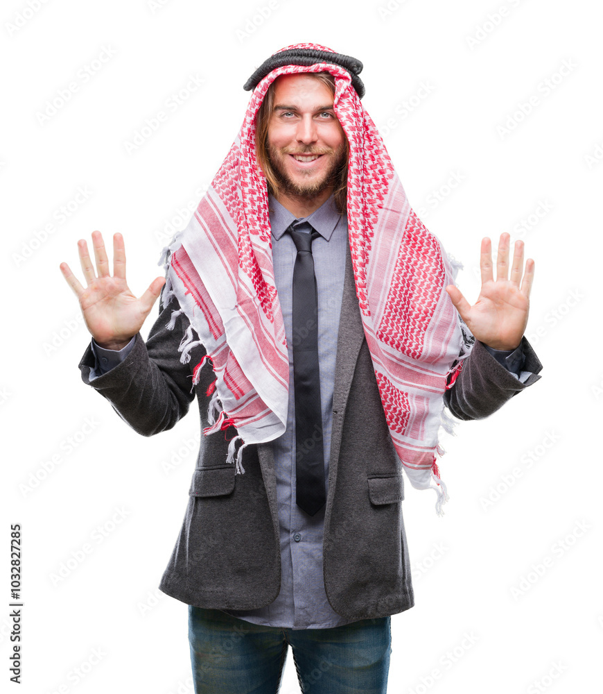Young handsome arabian man with long hair wearing keffiyeh over isolated background showing and pointing up with fingers number ten while smiling confident and happy. Young handsome arabian man with long hair wearing keffiyeh over isolated background showing and pointing up with fingers number ten while smiling confident and happy.