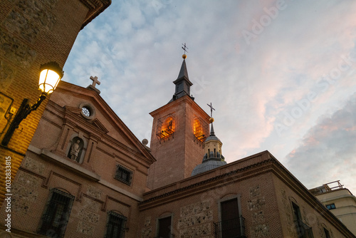 Church of Saint Genesius tower illuminated at dusk in Madrid, Spain - Landscape