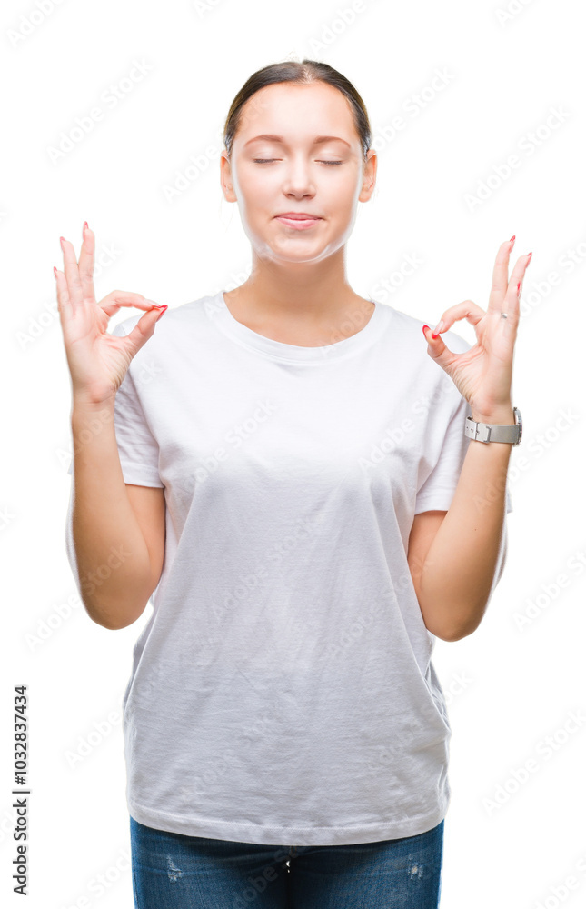 Young beautiful caucasian woman over isolated background relax and smiling with eyes closed doing meditation gesture with fingers. Yoga concept. Young beautiful caucasian woman over isolated background relax and smiling with eyes closed doing meditation gesture with fingers. Yoga concept.