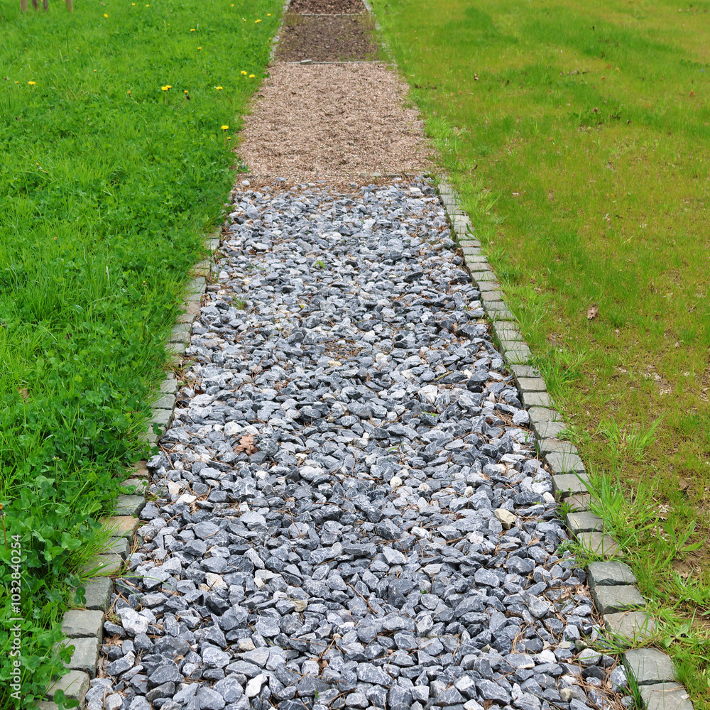 Gravel Pathway through Green Lawn in Garden Setting Gravel Pathway through Green Lawn in Garden Setting
