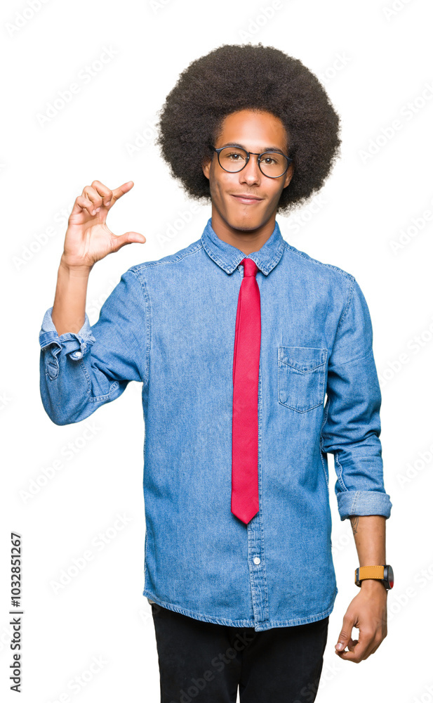 Young african american business man with afro hair wearing glasses and red tie smiling and confident gesturing with hand doing size sign with fingers while looking and the camera. Measure concept. Young african american business man with afro hair wearing glasses and red tie smiling and confident gesturing with hand doing size sign with fingers while looking and the camera. Measure concept.