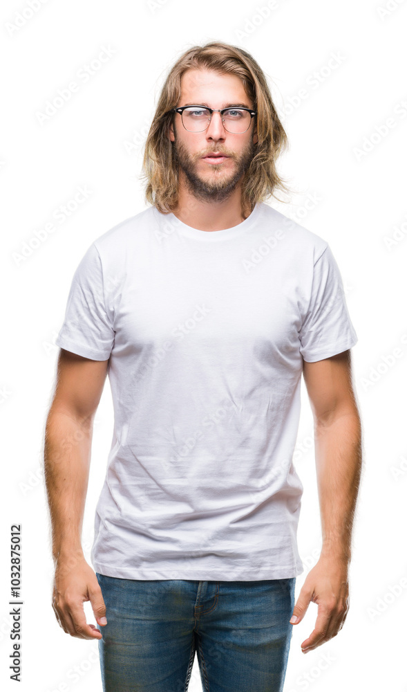 Fototapeta premium Young handsome man with long hair wearing glasses over isolated background with serious expression on face. Simple and natural looking at the camera.