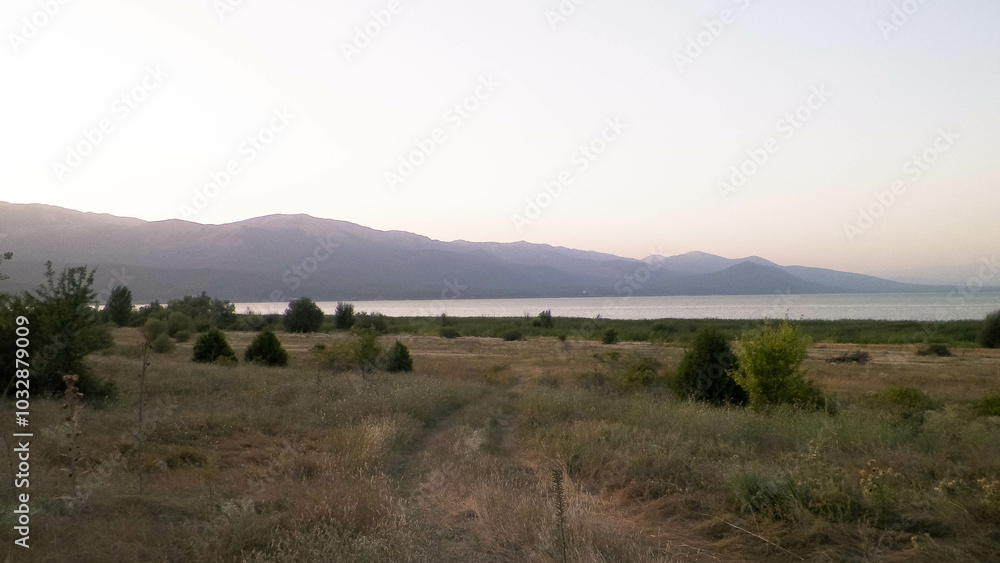 View on coast of Lake Prespa and Mountains of Galicica National Park, Macedonia View on coast of Lake Prespa and Mountains of Galicica National Park, Macedonia