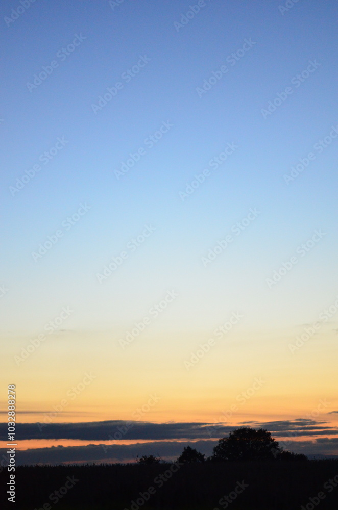 Beautiful sky background - Sunset Sunrise sky with light clouds and real sun Beautiful sky background - Sunset Sunrise sky with light clouds and real sun