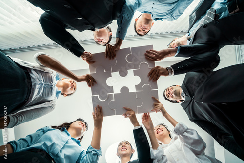 Fotografi Multiethnic business people holding jigsaw pieces and merge them together as effective solution solving teamwork, shared vision and common goal combining diverse talent