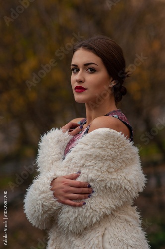 Close up trendy portrait of elegant young woman with big eyes and red lips