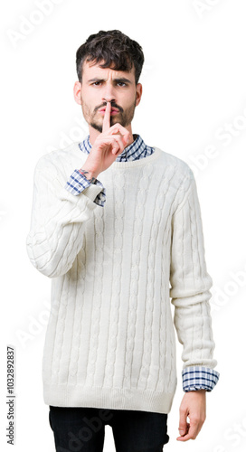 Young handsome man wearing winter sweater over isolated background asking to be quiet with finger on lips. Silence and secret concept.