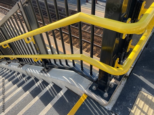Obraz na płótnie Yellow handrails and non-slip stairs on new staircase at railway station w salonie