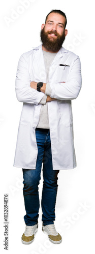 Canvas Print Young blond scientist man wearing white coat happy face smiling with crossed arms looking at the camera