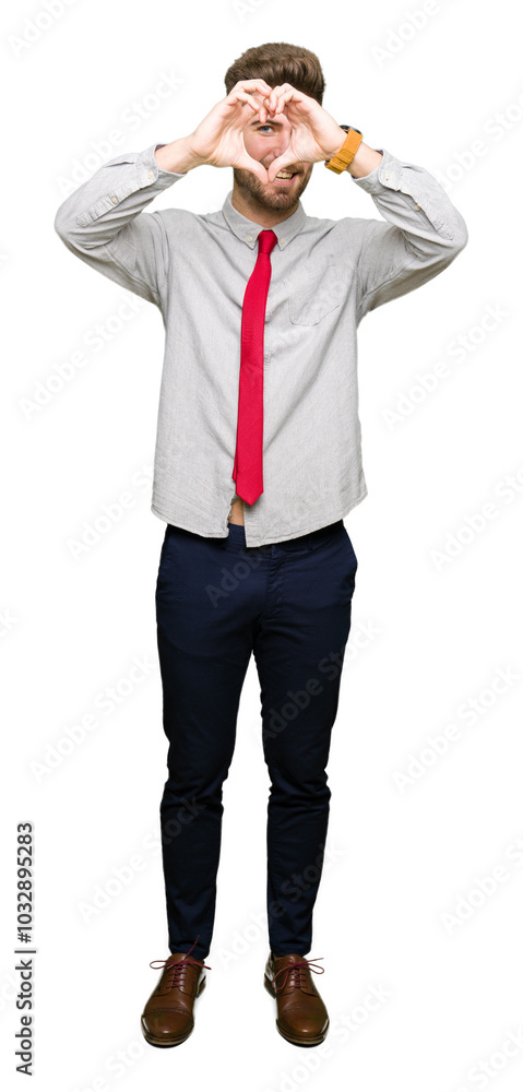 Young handsome business man Doing heart shape with hand and fingers smiling looking through sign Young handsome business man Doing heart shape with hand and fingers smiling looking through sign