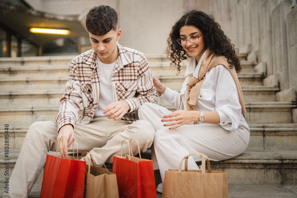 couple sit on stairs with shopping bags review what they shopping couple sit on stairs with shopping bags review what they shopping