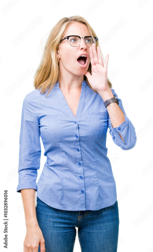 Beautiful young business woman over isolated background shouting and screaming loud to side with hand on mouth. Communication concept. Beautiful young business woman over isolated background shouting and screaming loud to side with hand on mouth. Communication concept.