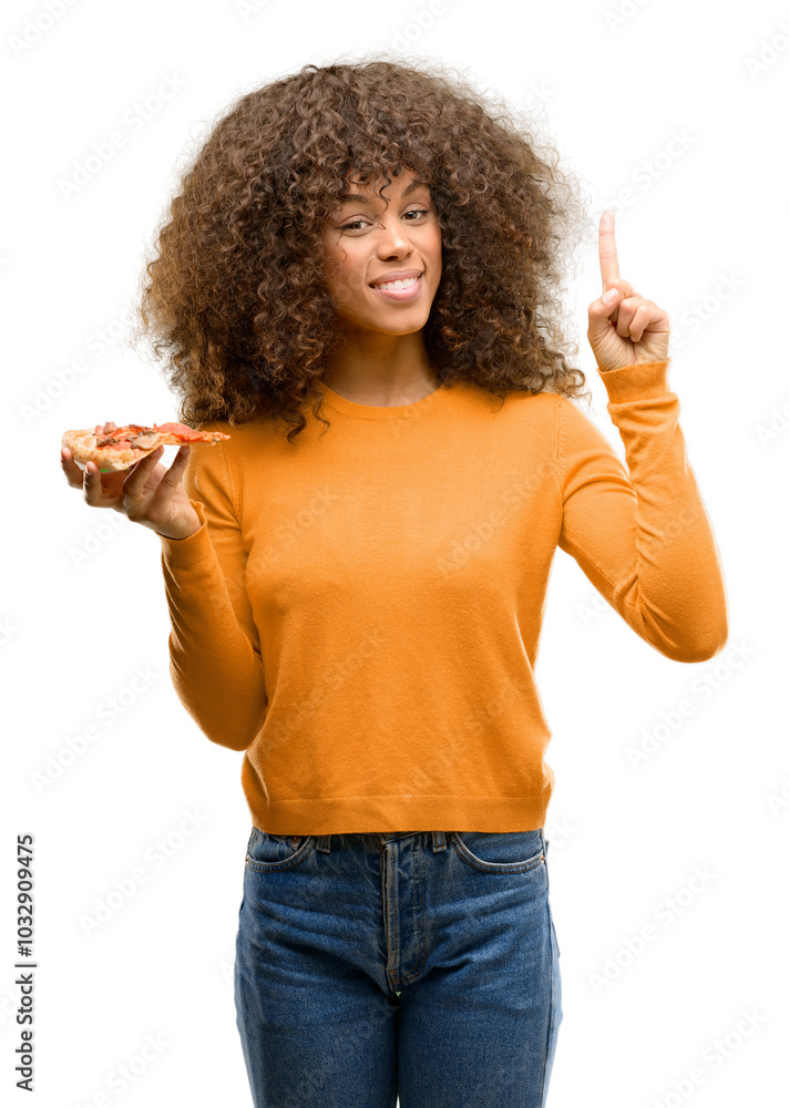 African american woman with a pizza slice surprised with an idea or question pointing finger with happy face, number one African american woman with a pizza slice surprised with an idea or question pointing finger with happy face, number one