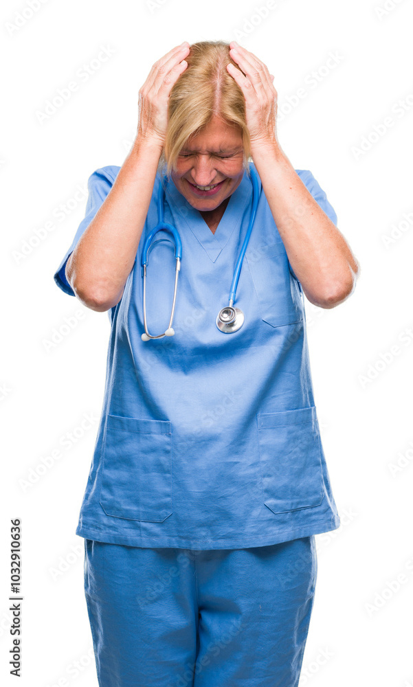 Middle age blonde nurse surgeon doctor woman over isolated background suffering from headache desperate and stressed because pain and migraine. Hands on head. Middle age blonde nurse surgeon doctor woman over isolated background suffering from headache desperate and stressed because pain and migraine. Hands on head.