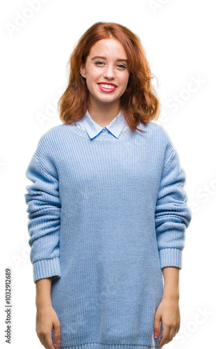 Young beautiful woman over isolated background wearing winter sweater with a happy and cool smile on face. Lucky person.