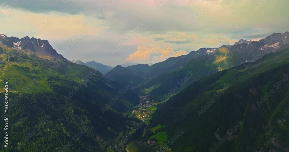 Drone Shot of Chamonix. Chamonix-Mont-Blanc is a resort town in France near the border with Switzerland and Italy. It is located at the foot of Mont Blanc, the highest peak in the Alps Drone Shot of Chamonix. Chamonix-Mont-Blanc is a resort town in France near the border with Switzerland and Italy. It is located at the foot of Mont Blanc, the highest peak in the Alps