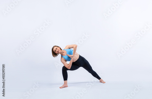 Full body length gaiety shot athletic and sporty woman doing healthy and meditative yoga exercise workout posture on isolated background. Healthy active and body care lifestyle