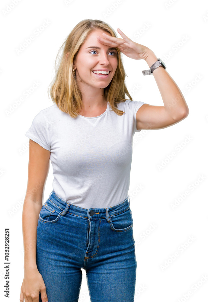 Beautiful young woman wearing casual white t-shirt over isolated background very happy and smiling looking far away with hand over head. Searching concept. Beautiful young woman wearing casual white t-shirt over isolated background very happy and smiling looking far away with hand over head. Searching concept.