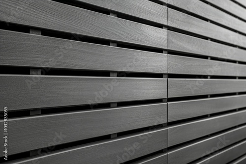 A wall made of wood slats, with a grayish color