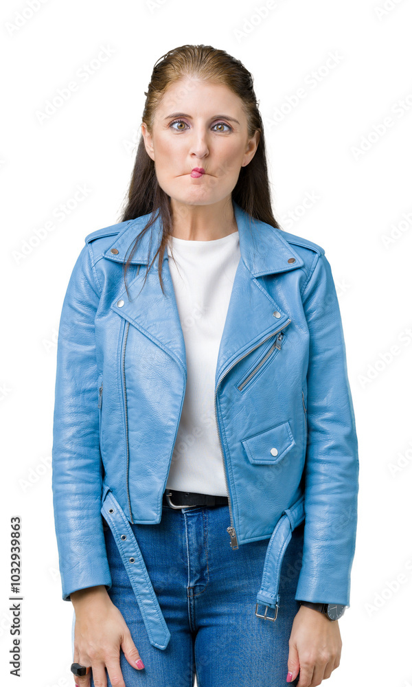 Beautiful middle age mature woman wearing fashion leather jacket over isolated background making fish face with lips, crazy and comical gesture. Funny expression.